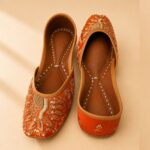 Rust Orange Leather Juttis with Traditional Gold Embroidery & Sequin Work