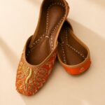 Rust Orange Leather Juttis with Traditional Gold Embroidery & Sequin Work