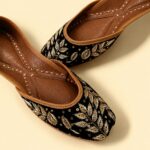Black Leather Juttis with Golden Botanical Beadwork and Handcrafted Embellishment