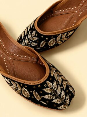 Black Leather Juttis with Golden Botanical Beadwork and Handcrafted Embellishment
