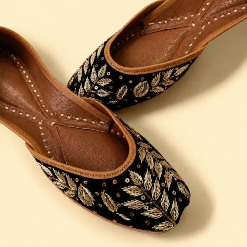Black Leather Juttis with Golden Botanical Beadwork and Handcrafted Embellishment