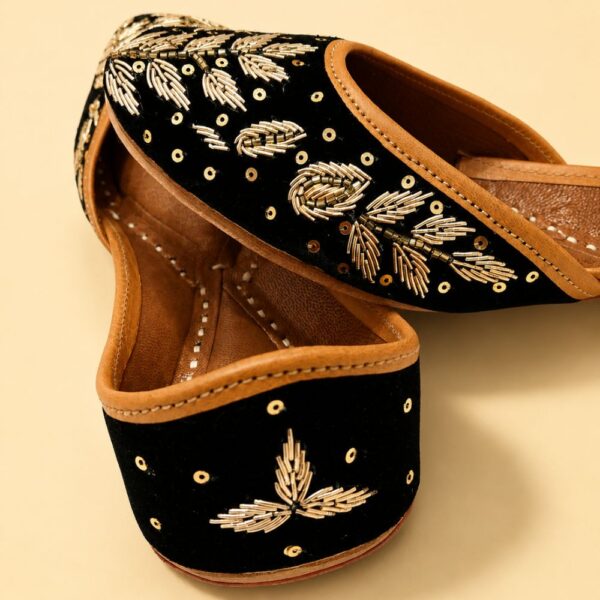 Black Leather Juttis with Golden Botanical Beadwork and Handcrafted Embellishment
