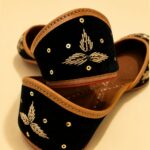 Black Leather Juttis with Golden Botanical Beadwork and Handcrafted Embellishment