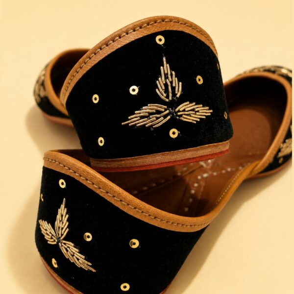 Black Leather Juttis with Golden Botanical Beadwork and Handcrafted Embellishment