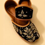 Black Leather Juttis with Golden Botanical Beadwork and Handcrafted Embellishment